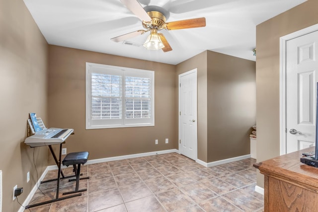 living area with visible vents, baseboards, light tile patterned flooring, and a ceiling fan