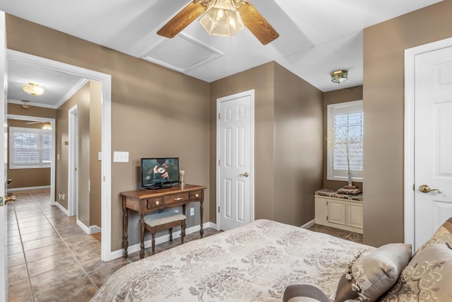 bedroom with baseboards, multiple windows, attic access, and tile patterned flooring