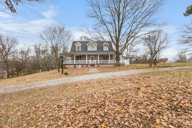 farmhouse-style home featuring covered porch
