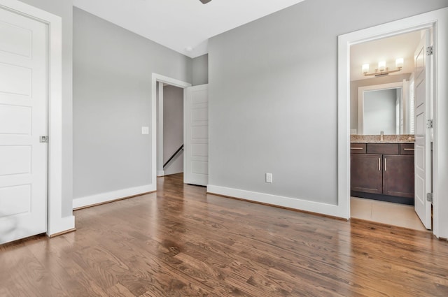 2003 Convent Pl Unit 6, Nashville, TN 37212 - unfurnished bedroom featuring a sink, wood finished floors, baseboards, and ensuite bath