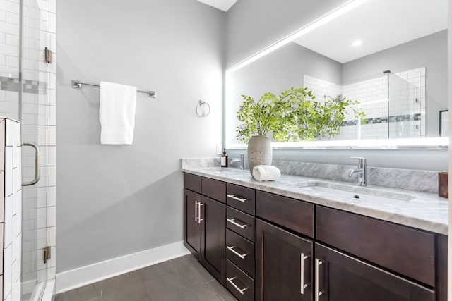 2003 Convent Pl Unit 6, Nashville, TN 37212 - bathroom with a stall shower, double vanity, and baseboards