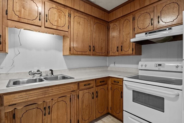 kitchen with under cabinet range hood, light countertops, brown cabinetry, and white range with electric stovetop