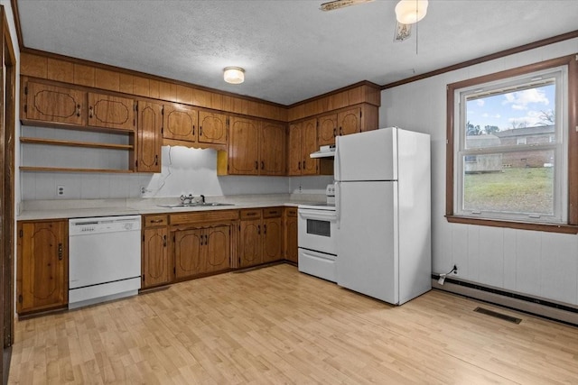 kitchen featuring white appliances, brown cabinetry, light wood-style flooring, light countertops, and under cabinet range hood