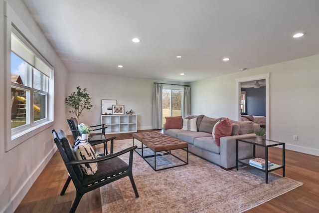 living area featuring recessed lighting, wood finished floors, and baseboards