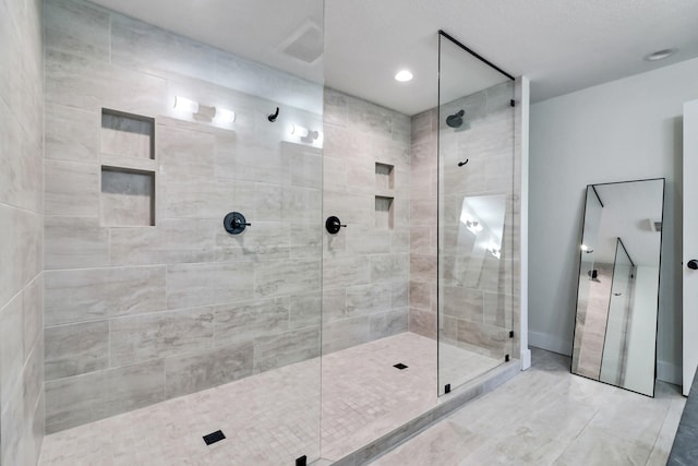 full bathroom with a tile shower