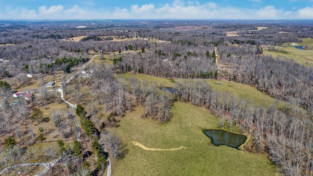 drone / aerial view with a view of trees