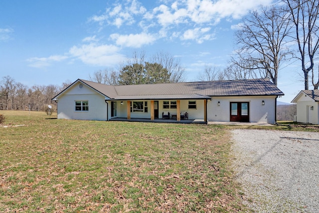 ranch-style house featuring brick siding and a front yard