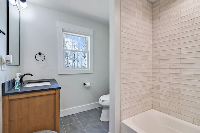 full bath featuring tile patterned floors, toilet, tub / shower combination, baseboards, and vanity