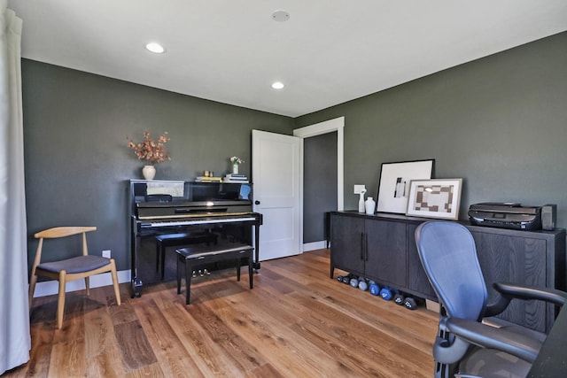 home office featuring recessed lighting, wood finished floors, and baseboards