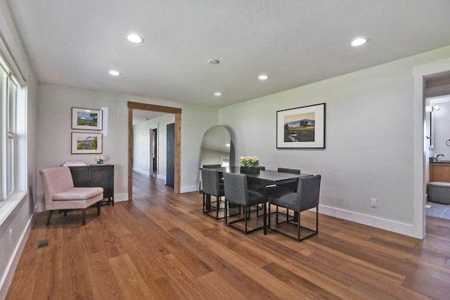 dining space featuring visible vents, recessed lighting, and wood finished floors