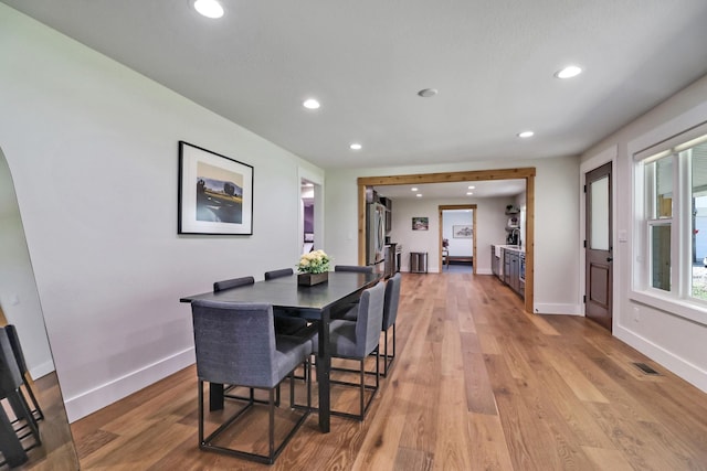 dining space with light wood-style flooring, recessed lighting, baseboards, and visible vents