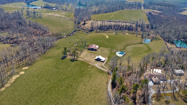 birds eye view of property with a rural view