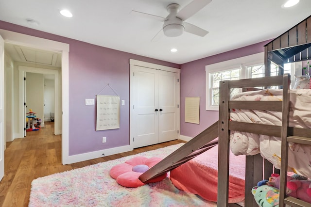 bedroom with recessed lighting, baseboards, attic access, and light wood finished floors