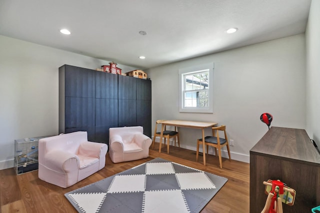 sitting room featuring recessed lighting, baseboards, and wood finished floors