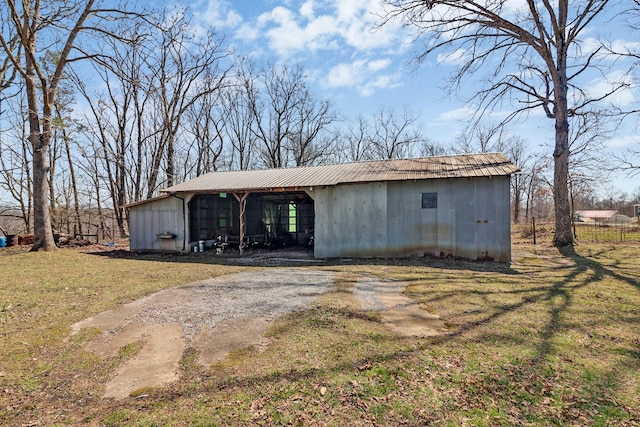 view of pole building with a lawn