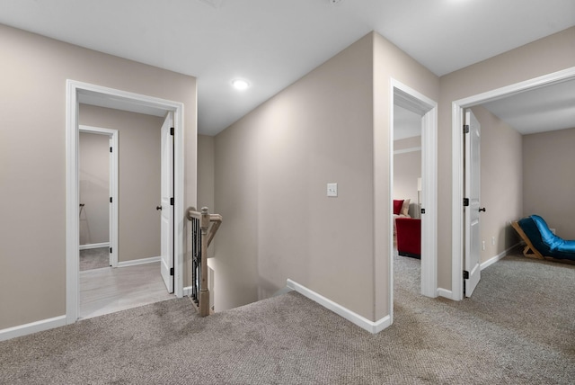 1561 Kestrel Dr, Clarksville, TN 37040 - hallway featuring baseboards, an upstairs landing, and carpet flooring