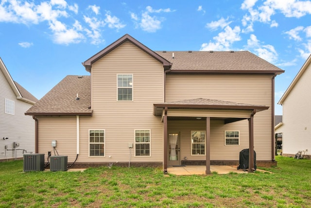 1561 Kestrel Dr, Clarksville, TN 37040 - rear view of property with central AC unit, a patio area, a lawn, and roof with shingles