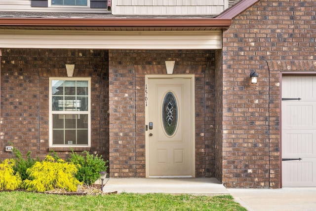 1561 Kestrel Dr, Clarksville, TN 37040 - property entrance featuring brick siding and a garage