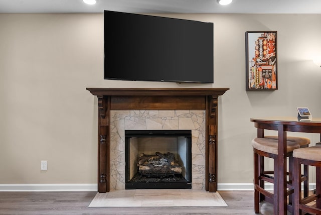 1561 Kestrel Dr, Clarksville, TN 37040 - room details with a fireplace with flush hearth, recessed lighting, baseboards, and wood finished floors