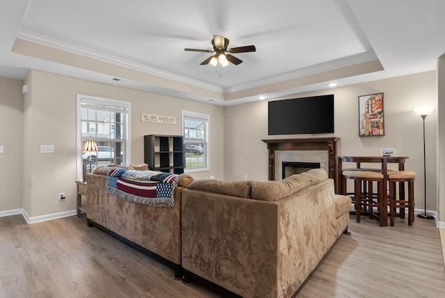 1561 Kestrel Dr, Clarksville, TN 37040 - living area with a tray ceiling, light wood finished floors, and ceiling fan