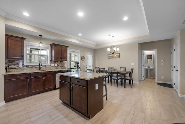 1561 Kestrel Dr, Clarksville, TN 37040 - kitchen with tasteful backsplash, dishwasher, a tray ceiling, a notable chandelier, and a sink