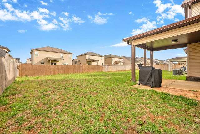 1561 Kestrel Dr, Clarksville, TN 37040 - view of yard featuring a patio, central air condition unit, a fenced backyard, and a residential view