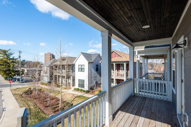 wooden terrace featuring a residential view