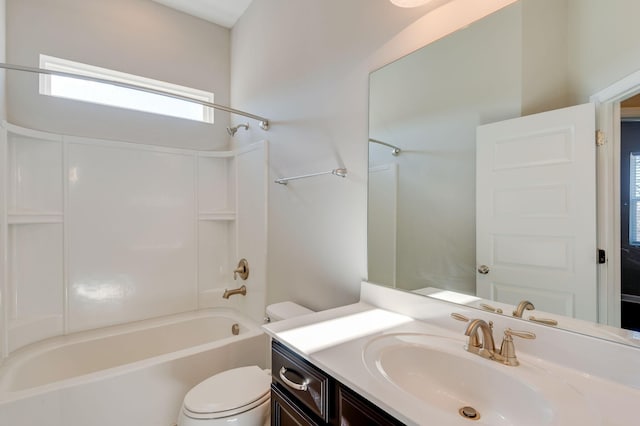 full bath with toilet, vanity, and bathtub / shower combination