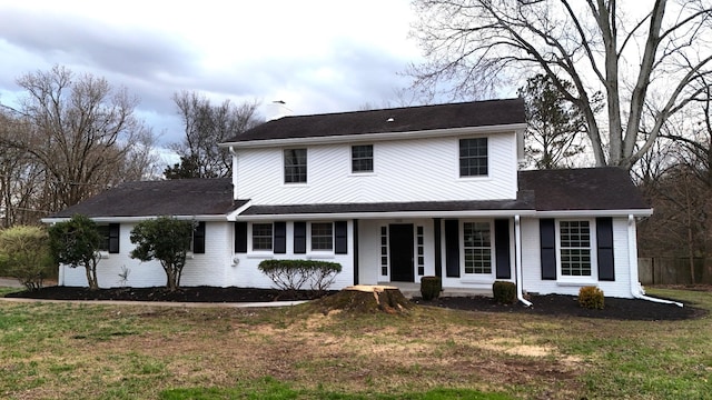 view of front of house featuring a front lawn and a porch