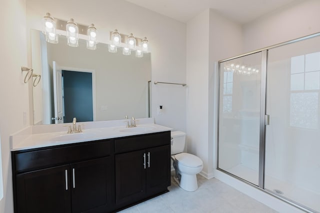 bathroom featuring a sink, toilet, and a stall shower