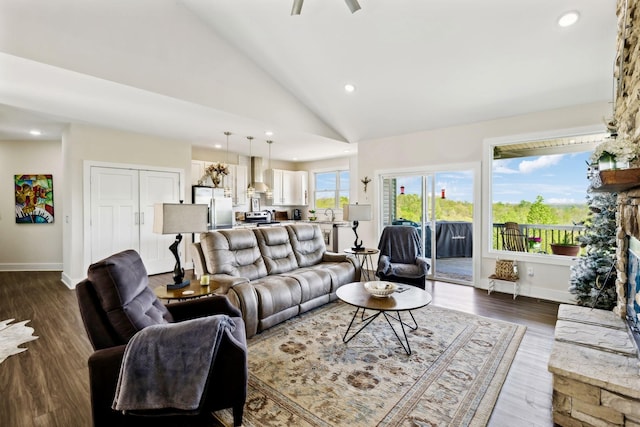 living area with dark wood-style flooring, baseboards, recessed lighting, a ceiling fan, and high vaulted ceiling