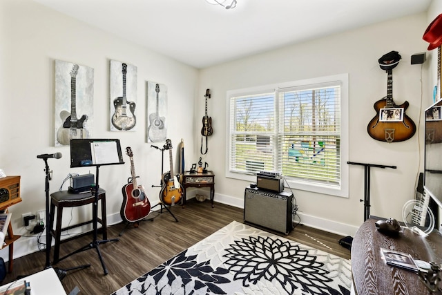 interior space featuring wood finished floors and baseboards