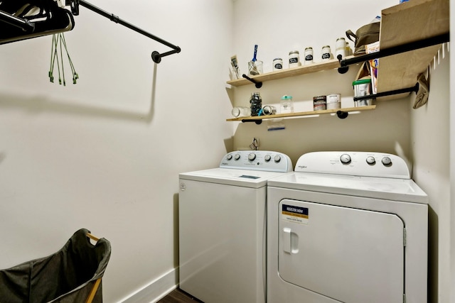 laundry room featuring separate washer and dryer and laundry area