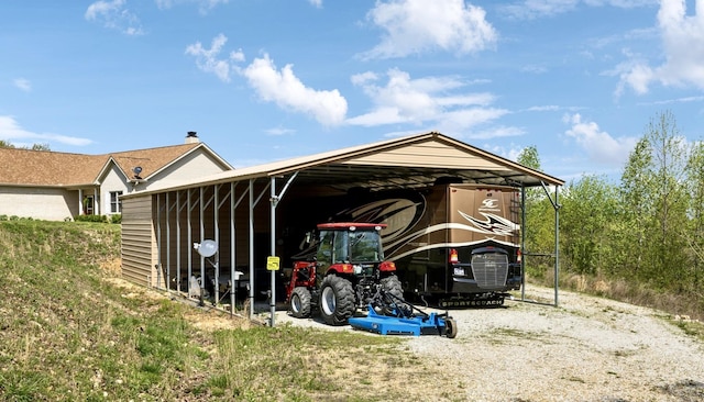 view of vehicle parking featuring a carport