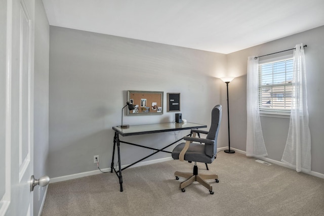 home office featuring carpet flooring, visible vents, and baseboards