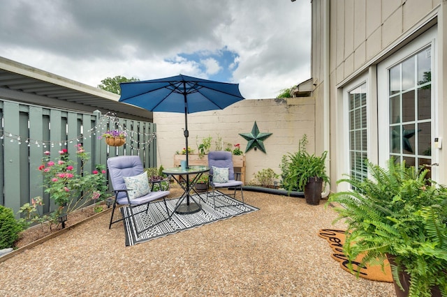 view of patio / terrace featuring fence