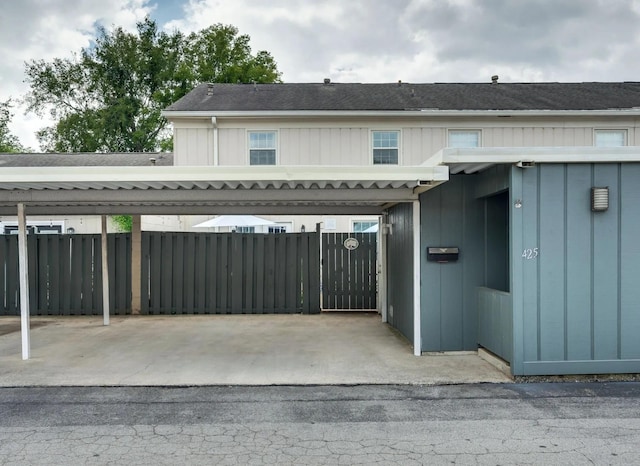 view of gate with fence