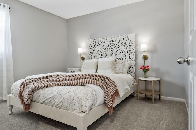 bedroom featuring carpet flooring and baseboards