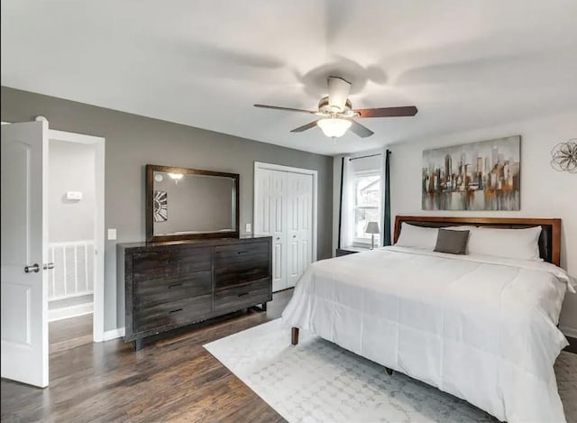 bedroom featuring a ceiling fan, wood finished floors, visible vents, and a closet