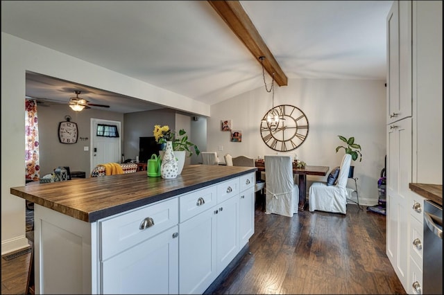 kitchen featuring dark wood-style floors, lofted ceiling with beams, butcher block counters, dishwasher, and a center island