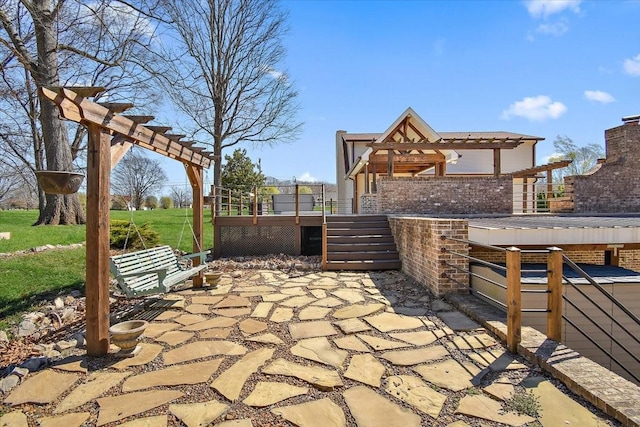 view of patio with a deck and a pergola