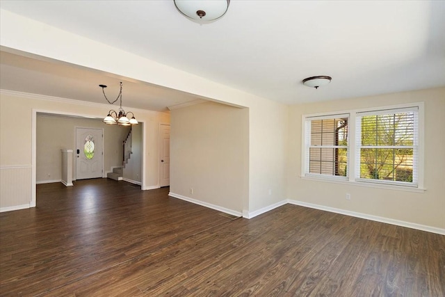 unfurnished room featuring stairs, a notable chandelier, baseboards, and dark wood-style flooring