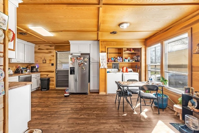 112 Shasteen St, Estill Springs, TN 37330 - kitchen with dark wood-style floors, white cabinetry, wooden walls, and stainless steel appliances