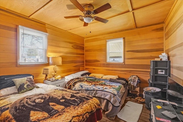 112 Shasteen St, Estill Springs, TN 37330 - bedroom with wood finished floors, wood walls, and a ceiling fan