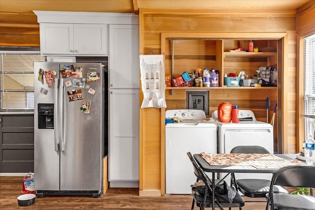 112 Shasteen St, Estill Springs, TN 37330 - kitchen with white cabinetry, stainless steel fridge, washer and clothes dryer, wood walls, and wood finished floors