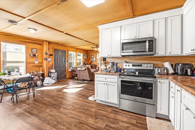 112 Shasteen St, Estill Springs, TN 37330 - kitchen featuring white cabinets, visible vents, appliances with stainless steel finishes, and dark wood finished floors