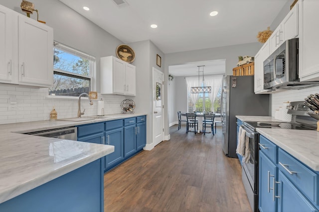 1000 Blair Oaks Ct, La Vergne, TN 37086 - kitchen featuring blue cabinetry, white cabinets, appliances with stainless steel finishes, and a sink