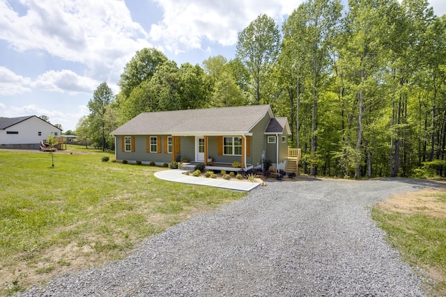 ranch-style house with a porch, a front lawn, and driveway