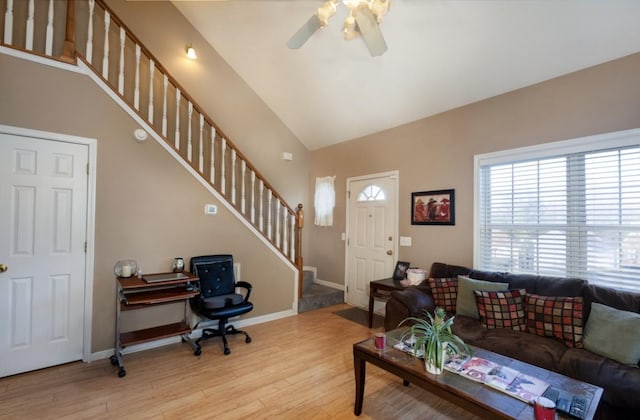 4241 Kevinwood Ct, Antioch, TN 37013 - living area with a ceiling fan, wood finished floors, stairs, vaulted ceiling, and a desk