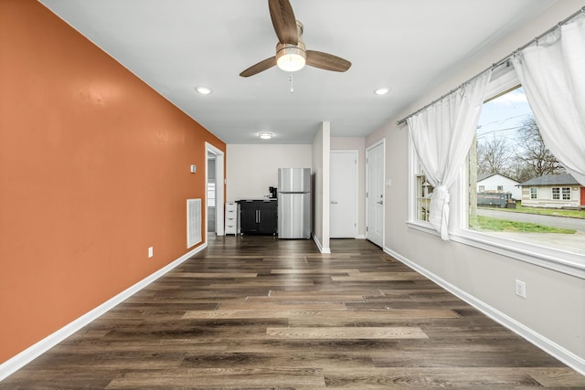 unfurnished living room with a ceiling fan, baseboards, visible vents, recessed lighting, and dark wood-type flooring